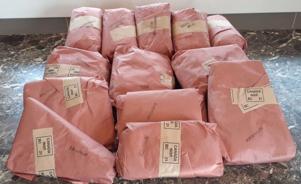 Packages of beef in brown paper